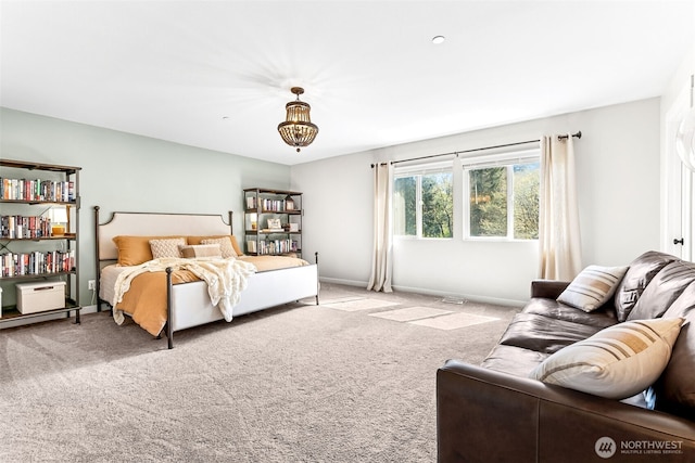 bedroom featuring baseboards and carpet