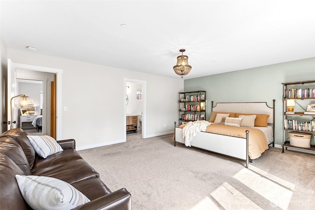 bedroom with baseboards and carpet