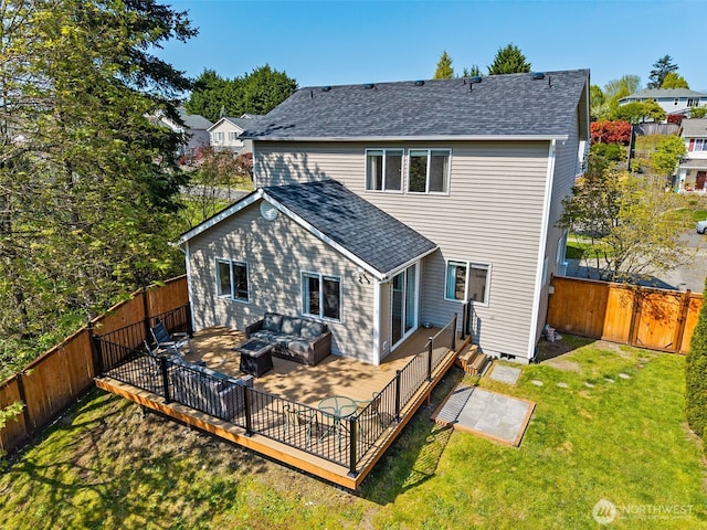 rear view of house with a yard, a patio, a fenced backyard, and roof with shingles