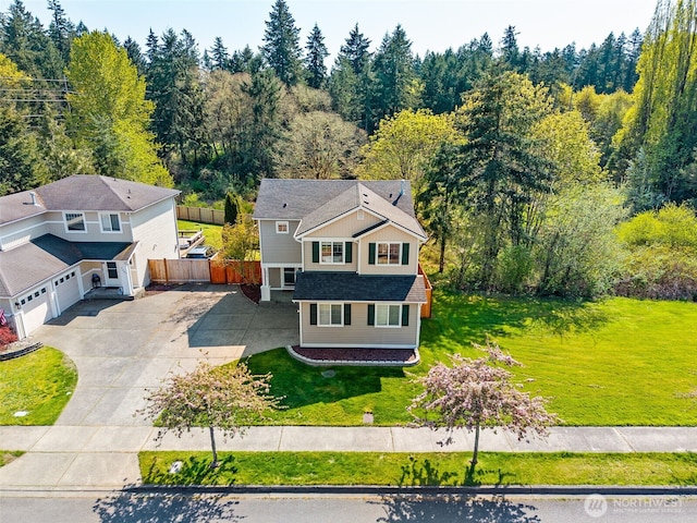 drone / aerial view featuring a view of trees