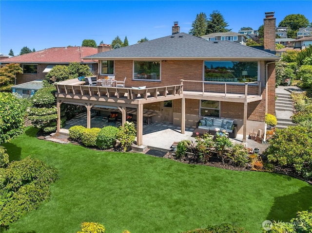 6743 40th Ave SW, Seattle, WA 98136 - rear view of house with a patio area, an outdoor living space, a yard, a wooden deck, and a chimney