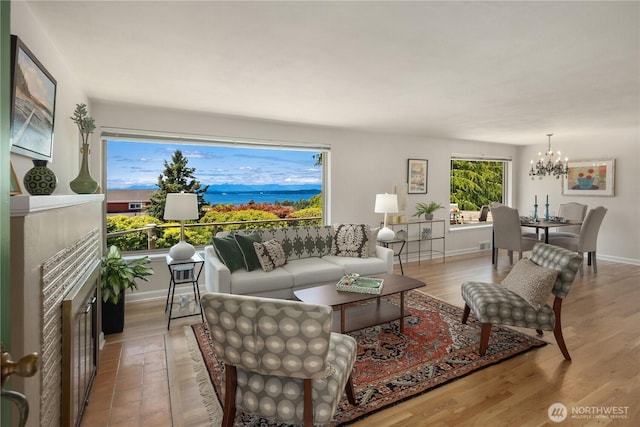 6743 40th Ave SW, Seattle, WA 98136 - living area featuring wood finished floors and a chandelier