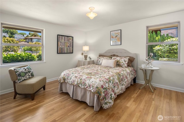 6743 40th Ave SW, Seattle, WA 98136 - bedroom featuring light wood-style floors and baseboards