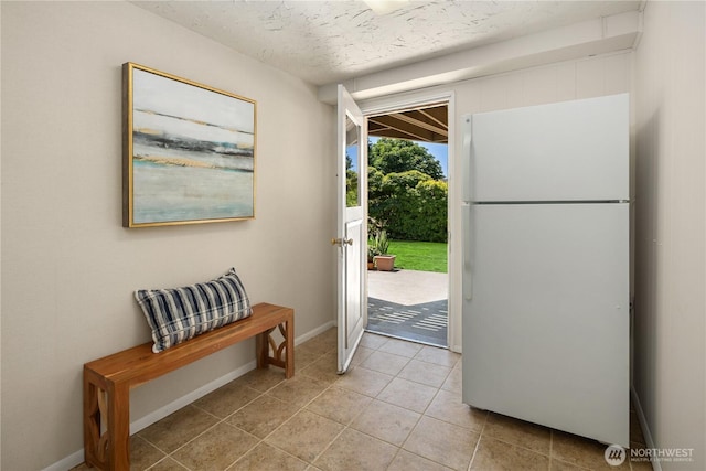 6743 40th Ave SW, Seattle, WA 98136 - foyer entrance with light tile patterned floors and a textured ceiling