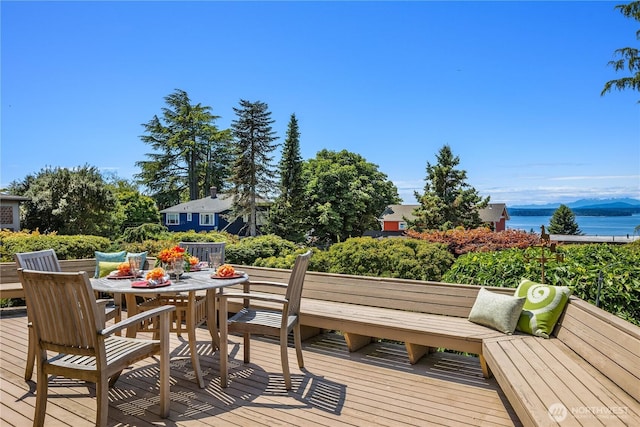 6743 40th Ave SW, Seattle, WA 98136 - wooden deck featuring a water view and outdoor dining area