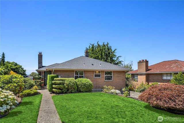 6743 40th Ave SW, Seattle, WA 98136 - rear view of property with a yard, brick siding, and a chimney