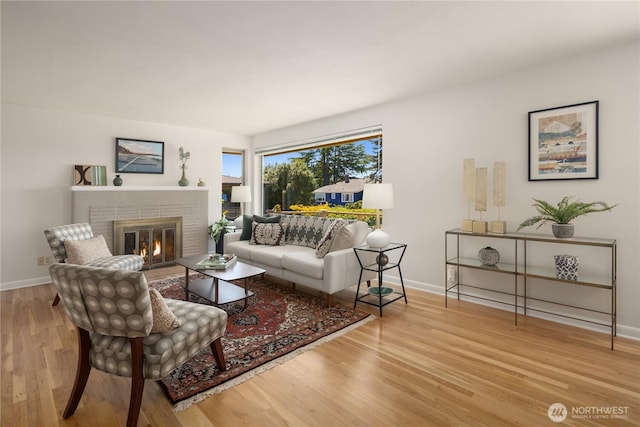 6743 40th Ave SW, Seattle, WA 98136 - living room featuring wood finished floors and a fireplace