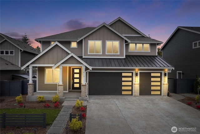 craftsman-style house featuring a garage, fence, a standing seam roof, board and batten siding, and driveway