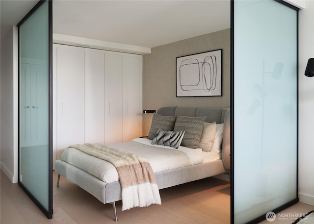 300 Virginia St Unit 2701, Seattle, WA 98101 - bedroom with baseboards and a closet