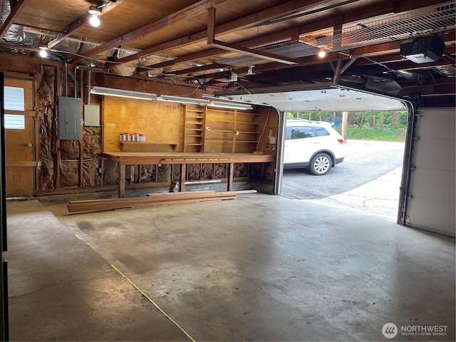 2940 161st Ave SE, Bellevue, WA 98008 - garage featuring electric panel and a garage door opener