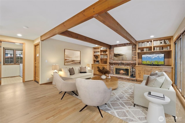 living room with light wood-style floors, baseboards, recessed lighting, a fireplace, and beam ceiling
