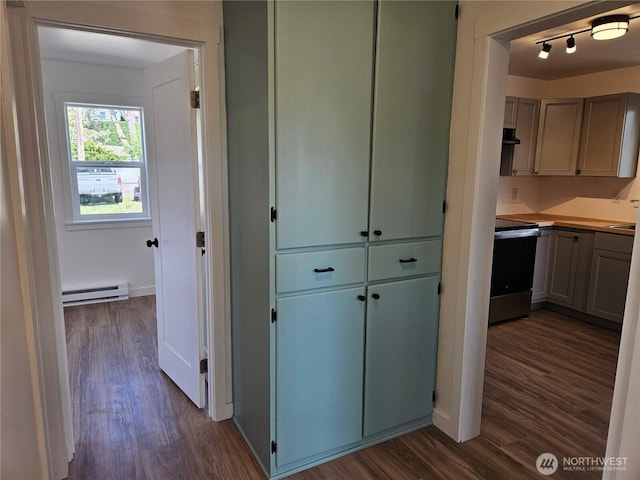 hall with track lighting, baseboards, baseboard heating, and dark wood finished floors