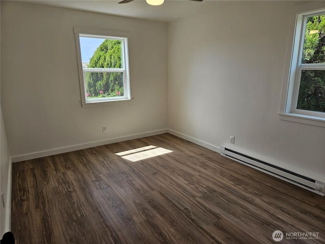unfurnished room with baseboards, a baseboard radiator, ceiling fan, and wood finished floors