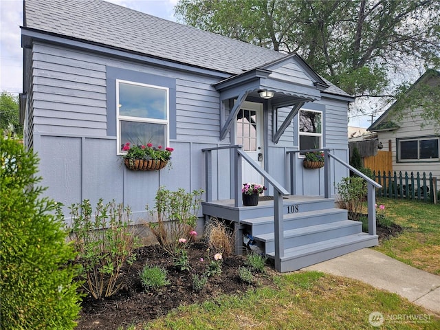108 W 3rd St, Lind, WA 99341 - view of front of house with fence and a shingled roof