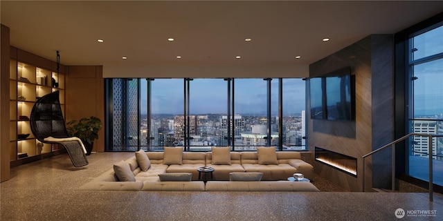 living area with built in features and recessed lighting