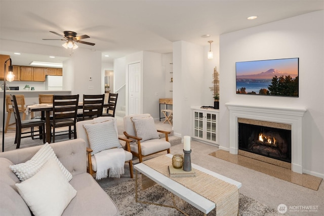 11547 SE 175th St Unit 1, Renton, WA 98058 - living room with ceiling fan, light carpet, a lit fireplace, recessed lighting, and baseboards