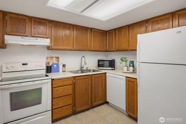 11547 SE 175th St Unit 1, Renton, WA 98058 - kitchen with white appliances, under cabinet range hood, a sink, and light countertops