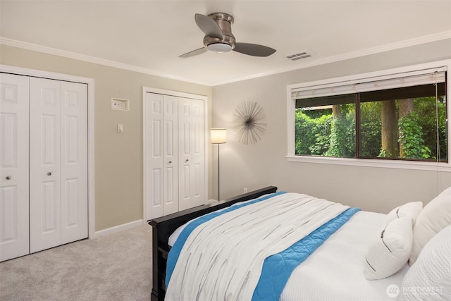 11547 SE 175th St Unit 1, Renton, WA 98058 - carpeted bedroom with multiple closets, crown molding, baseboards, and ceiling fan