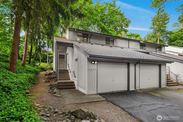 11547 SE 175th St Unit 1, Renton, WA 98058 - view of front of house featuring roof with shingles and a garage