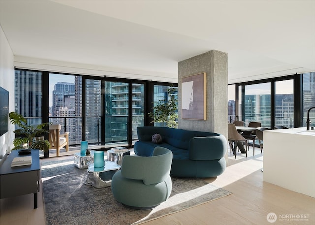 300 Virginia St Unit 1908, Seattle, WA 98101 - living area featuring a city view, floor to ceiling windows, and wood finished floors