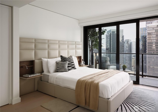 300 Virginia St Unit 1908, Seattle, WA 98101 - bedroom with a view of city, wood finished floors, and access to exterior