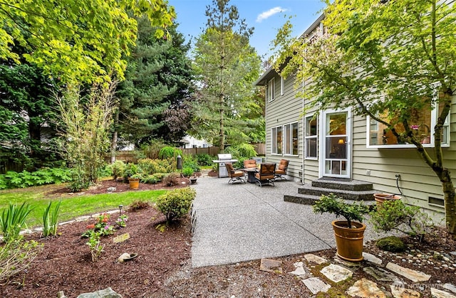 view of patio featuring fence and grilling area