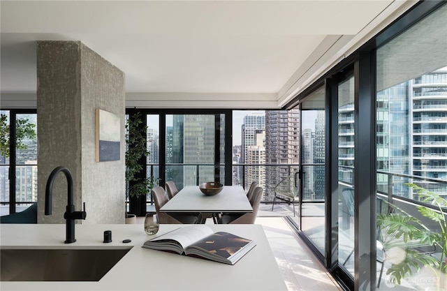 interior space featuring a city view and a sink