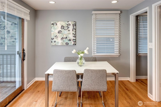 dining area with baseboards, recessed lighting, and light wood finished floors