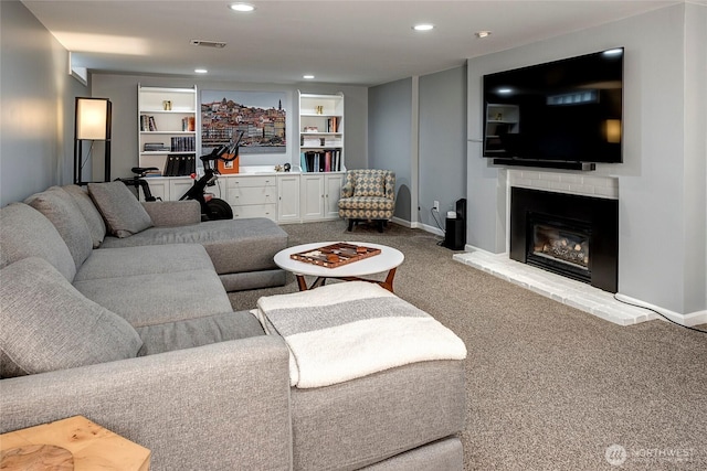 living area with visible vents, a fireplace, baseboards, recessed lighting, and carpet flooring