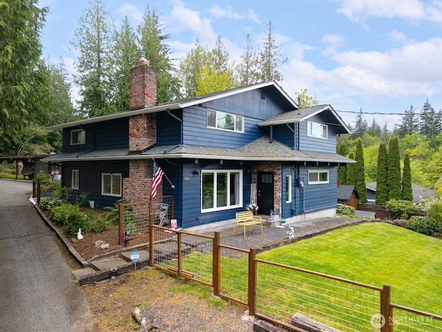 4130 Lakeway Dr, Bellingham, WA 98229 - view of front of house with fence, a chimney, and a front lawn