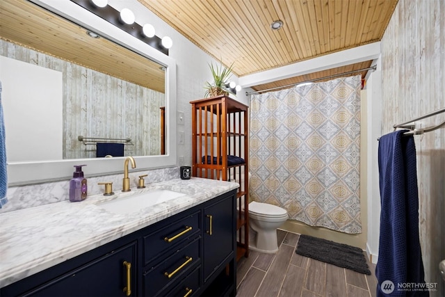 4130 Lakeway Dr, Bellingham, WA 98229 - full bath featuring wood finish floors, vanity, toilet, shower / bathtub combination with curtain, and wood ceiling