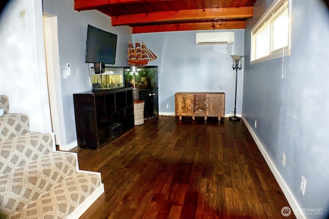 4130 Lakeway Dr, Bellingham, WA 98229 - unfurnished living room with a wall unit AC, hardwood / wood-style flooring, and beamed ceiling