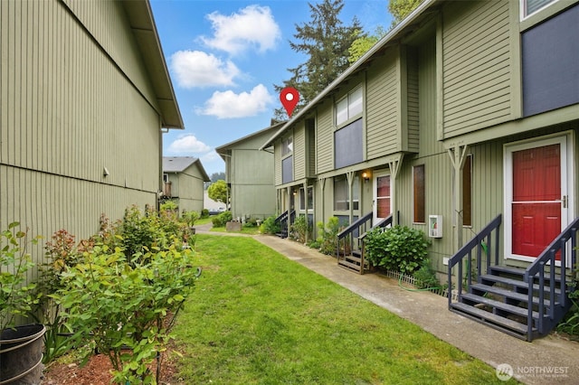 view of yard featuring entry steps
