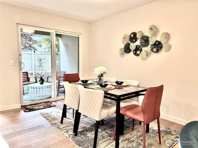 10221 NE 16th St Unit H5, Bellevue, WA 98004 - dining space with baseboards and wood finished floors