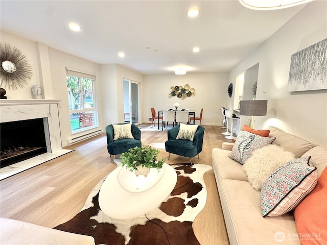 10221 NE 16th St Unit H5, Bellevue, WA 98004 - living area with wood finished floors, recessed lighting, a baseboard heating unit, and a high end fireplace