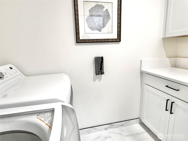 10221 NE 16th St Unit H5, Bellevue, WA 98004 - washroom featuring cabinet space, washer / dryer, and marble finish floor