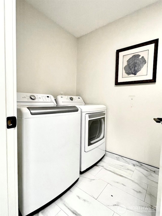 10221 NE 16th St Unit H5, Bellevue, WA 98004 - washroom featuring separate washer and dryer, laundry area, and marble finish floor