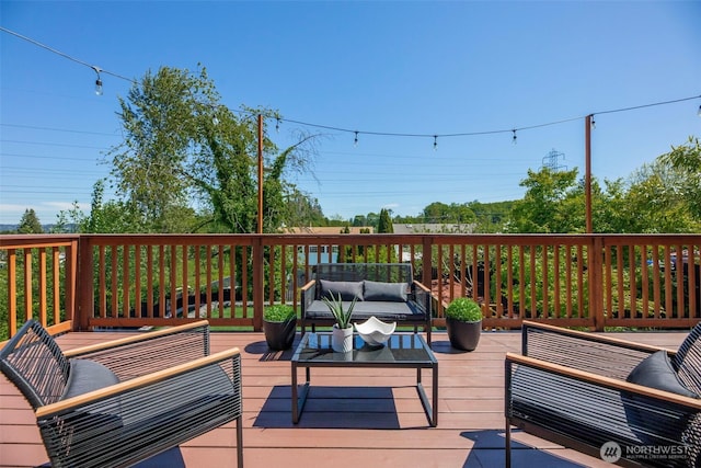 wooden terrace featuring an outdoor living space