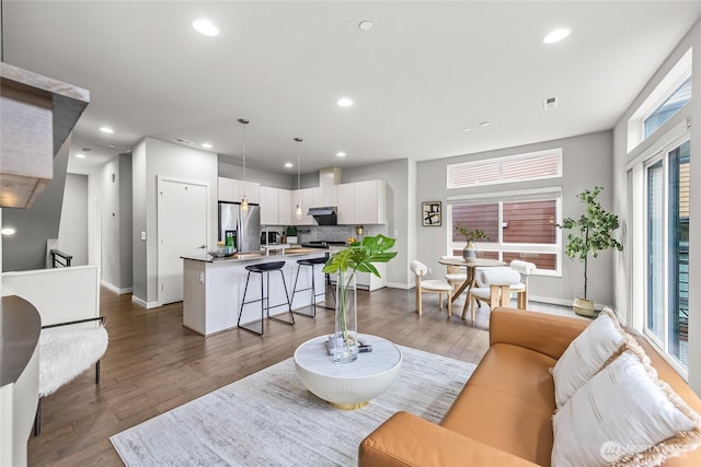 2055 NW Talus Dr Unit 3, Issaquah, WA 98027 - living area with baseboards, dark wood-style floors, and recessed lighting