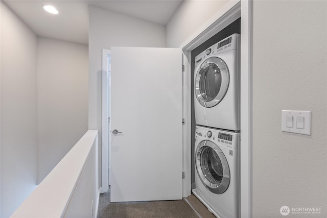 2055 NW Talus Dr Unit 3, Issaquah, WA 98027 - laundry area with estacked washer and dryer, dark colored carpet, and recessed lighting