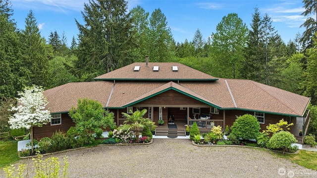 17613 Butler Rd, Snohomish, WA 98290 - chalet / cabin featuring covered porch and a forest view