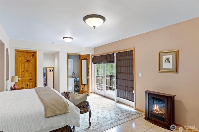 17613 Butler Rd, Snohomish, WA 98290 - bedroom featuring access to outside, a glass covered fireplace, and arched walkways