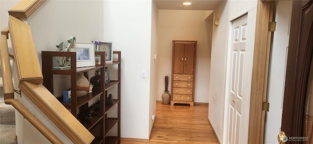 hallway with recessed lighting, baseboards, and light wood finished floors