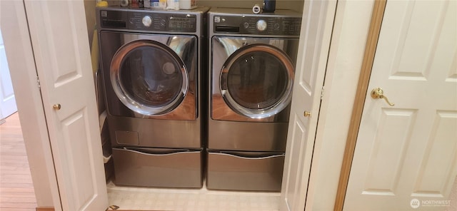 laundry area with independent washer and dryer and laundry area