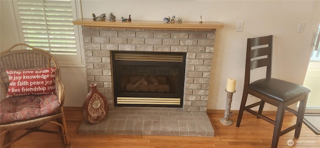 details with wood finished floors and a fireplace