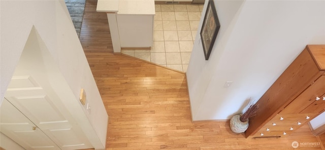 hallway with light wood-style floors