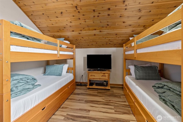 bedroom featuring wood finished floors, wood ceiling, and vaulted ceiling