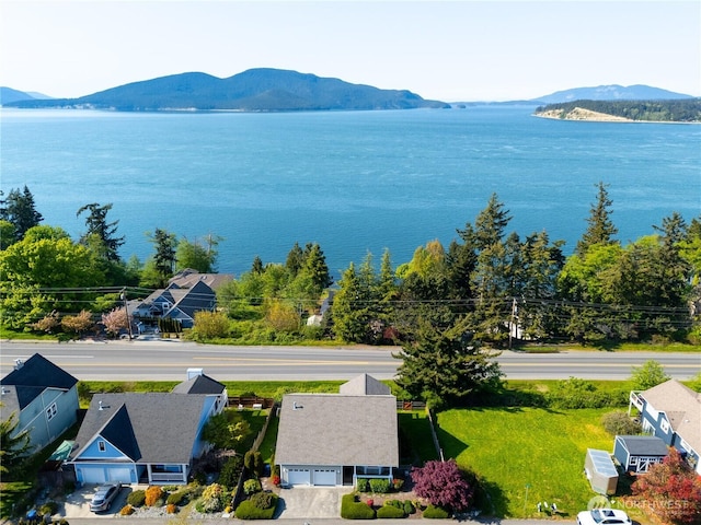 bird's eye view with a water and mountain view
