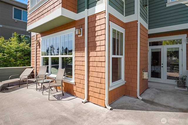 view of side of property featuring french doors