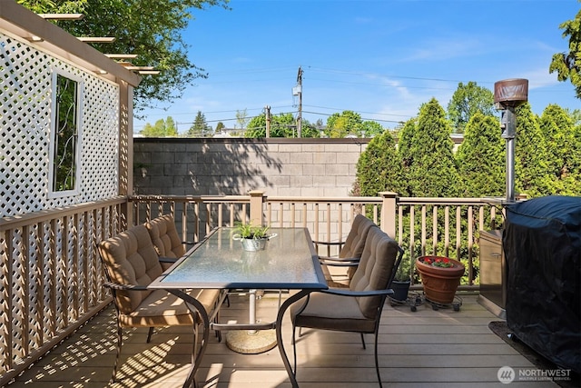 wooden deck featuring outdoor dining space
